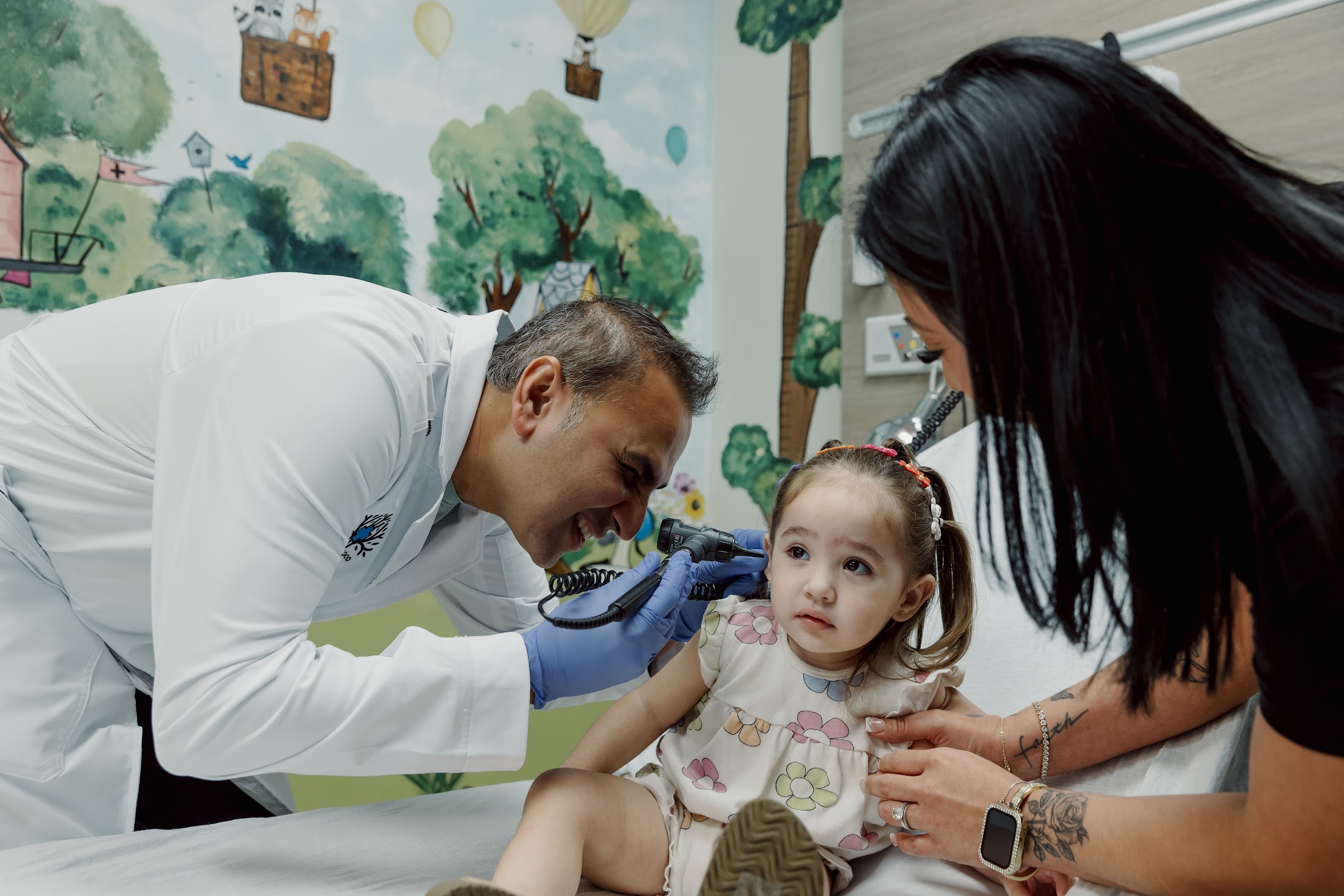 A Friendswood Hospital ER physician caring for a pediatric patient
